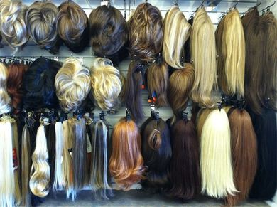 Human hair and synthetic toppers at Kim's Wig Botik, Denver, Colorado